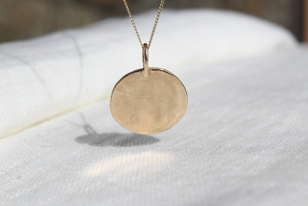 Gold coin pendant